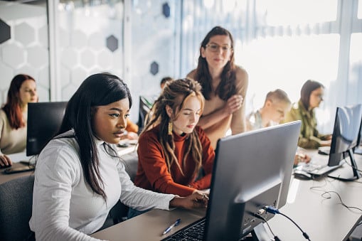 people gathered around a computer